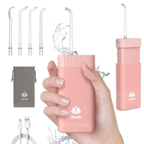 Caredite Portable Mini Water Flosser in Pink with 4 interchangeable tips and 3 modes, ideal for travel and home use