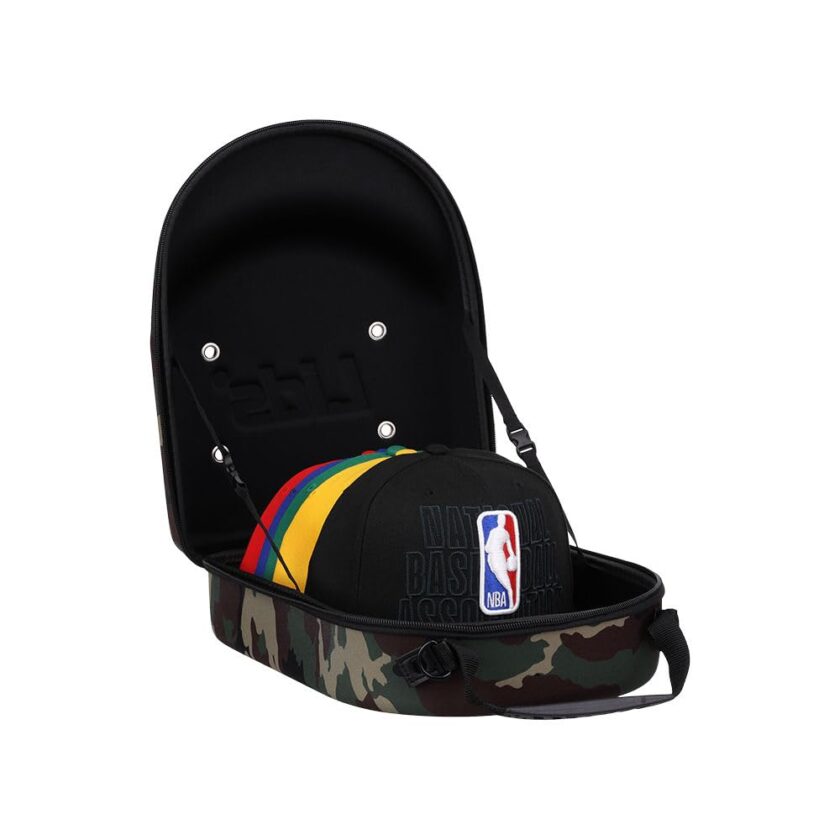 GRANNY SAYS Lids Cap Luggage Container with camo exterior and black interior, designed to hold and protect up to 6 baseball caps or hats, perfect for travel