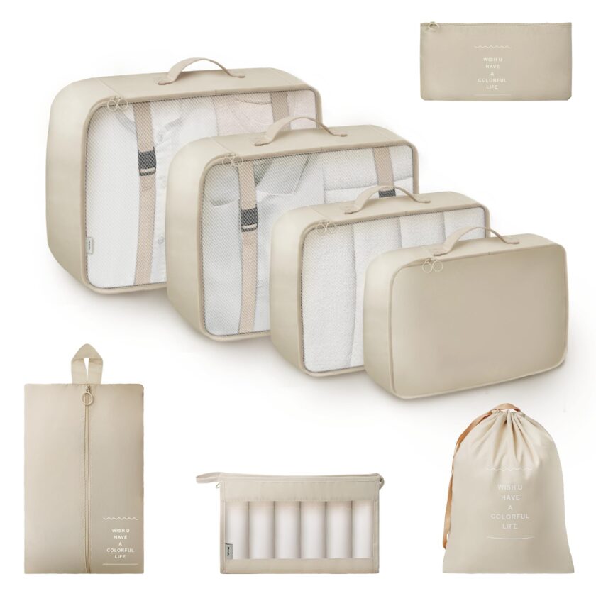 Beige 8-piece packing cube set from GRANNY SAYS, including various bags for organizing travel essentials, shown with travel gear