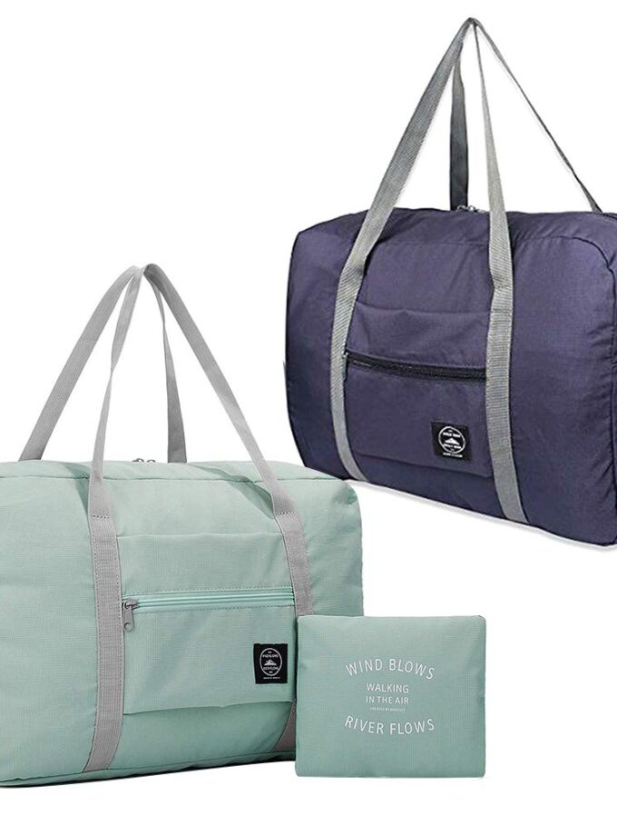 Light blue and dark blue foldable travel duffel bags, showing their spacious interior, waterproof fabric