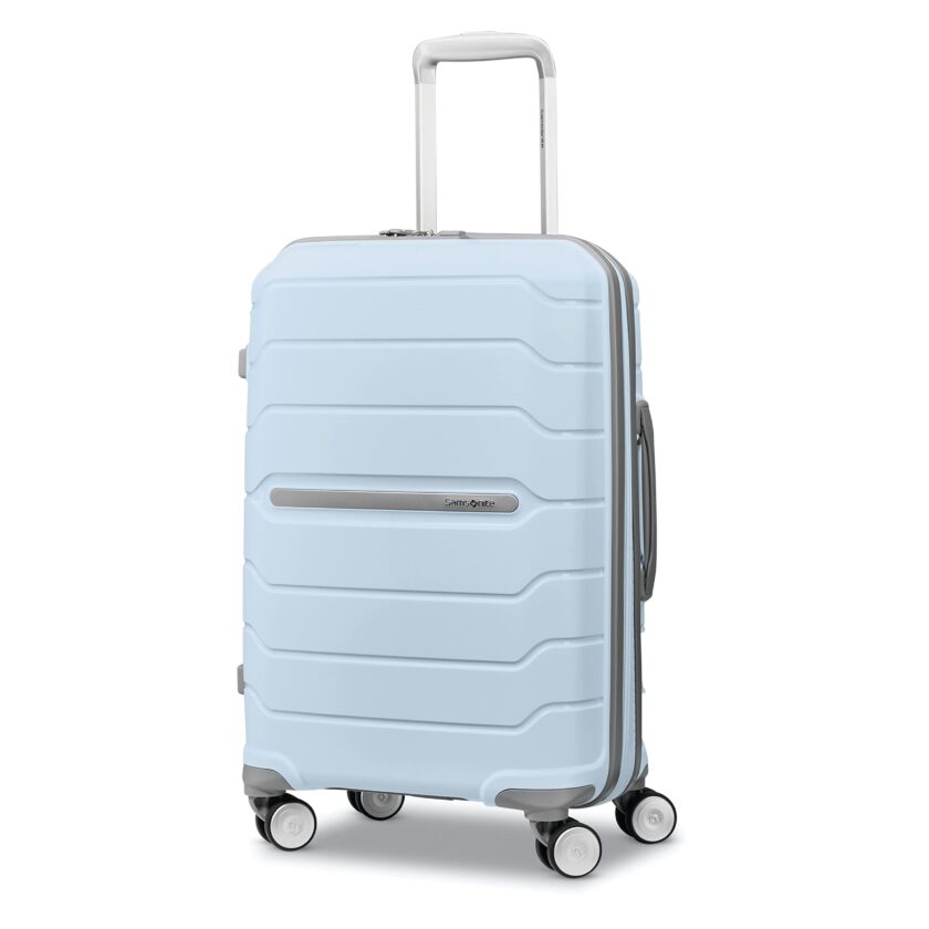 Powder blue 21-inch hardshell carry-on with TSA lock, double spinner wheels, and a sleek