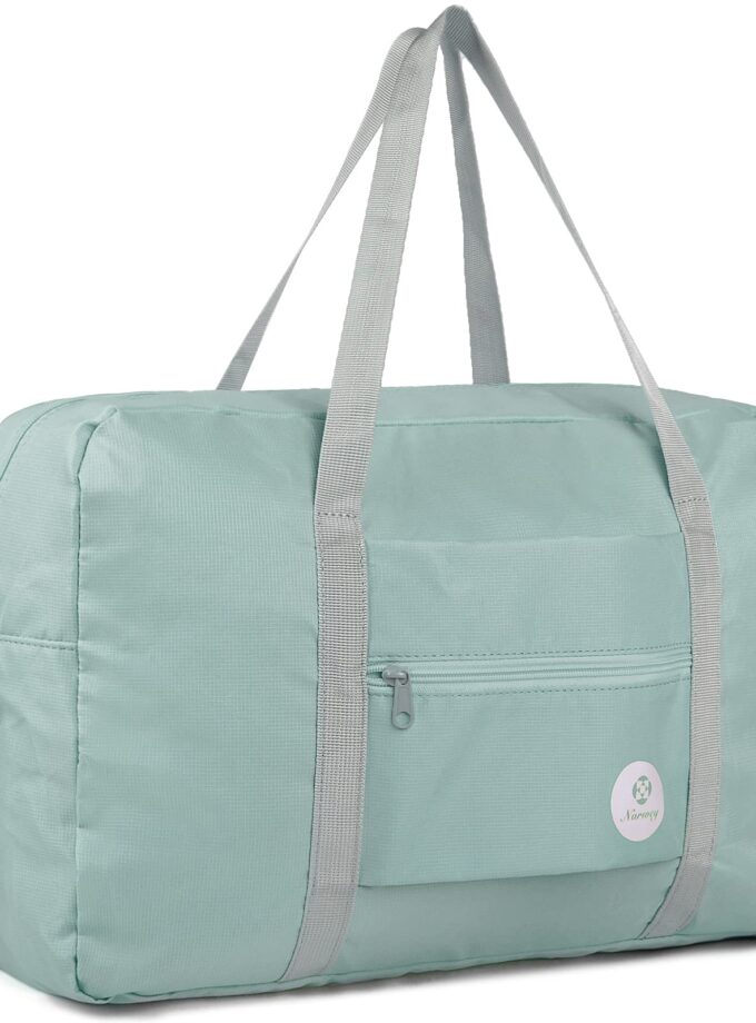 Mint green Narwey foldable travel duffel with shoulder strap and luggage pass-through, designed for easy carrying and fitting Spirit Airlines’ personal item size