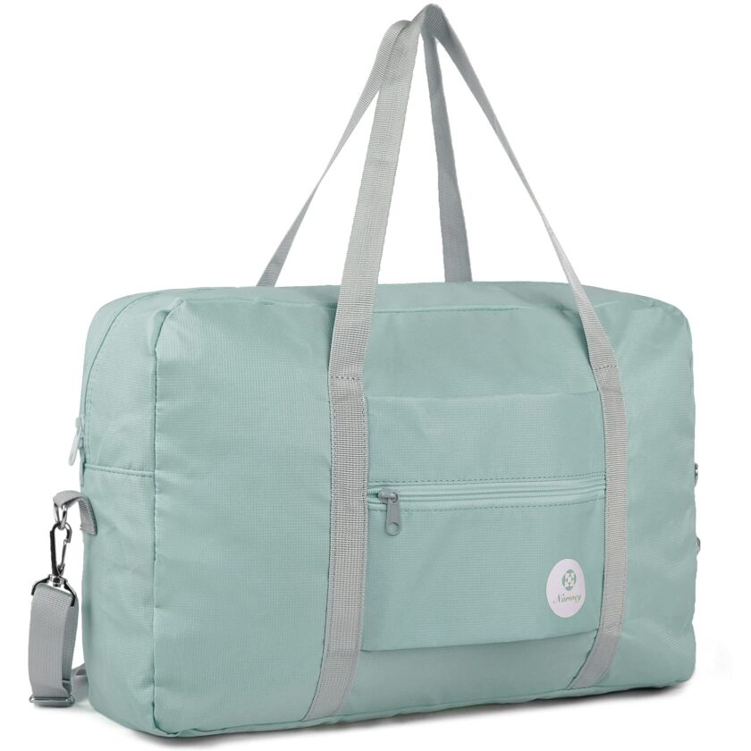 Mint green Narwey foldable travel duffel with shoulder strap and luggage pass-through, designed for easy carrying and fitting Spirit Airlines’ personal item size