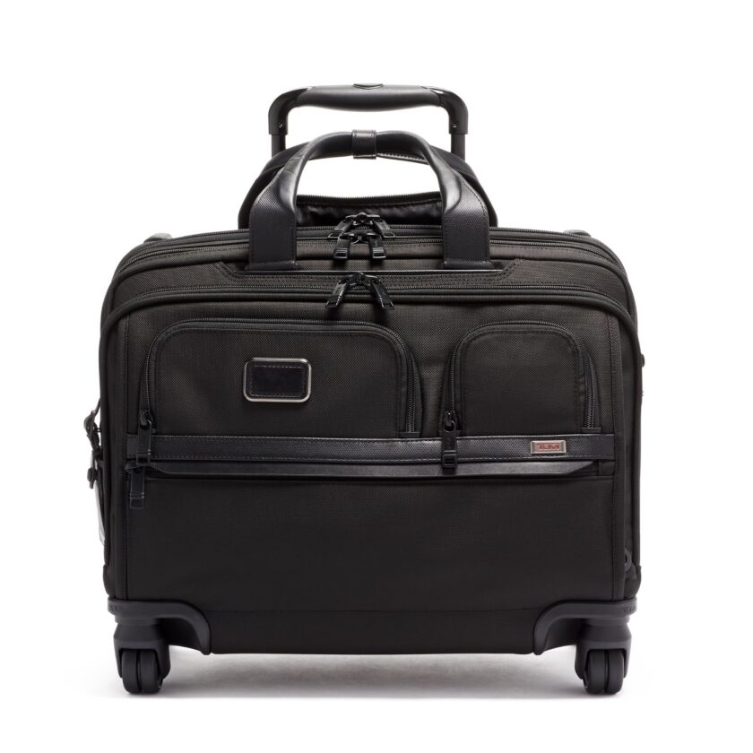 Elegant TUMI Alpha Deluxe 4 Wheeled Laptop Case in black, showcasing a sleek design with expandable features and a USB-C charging port